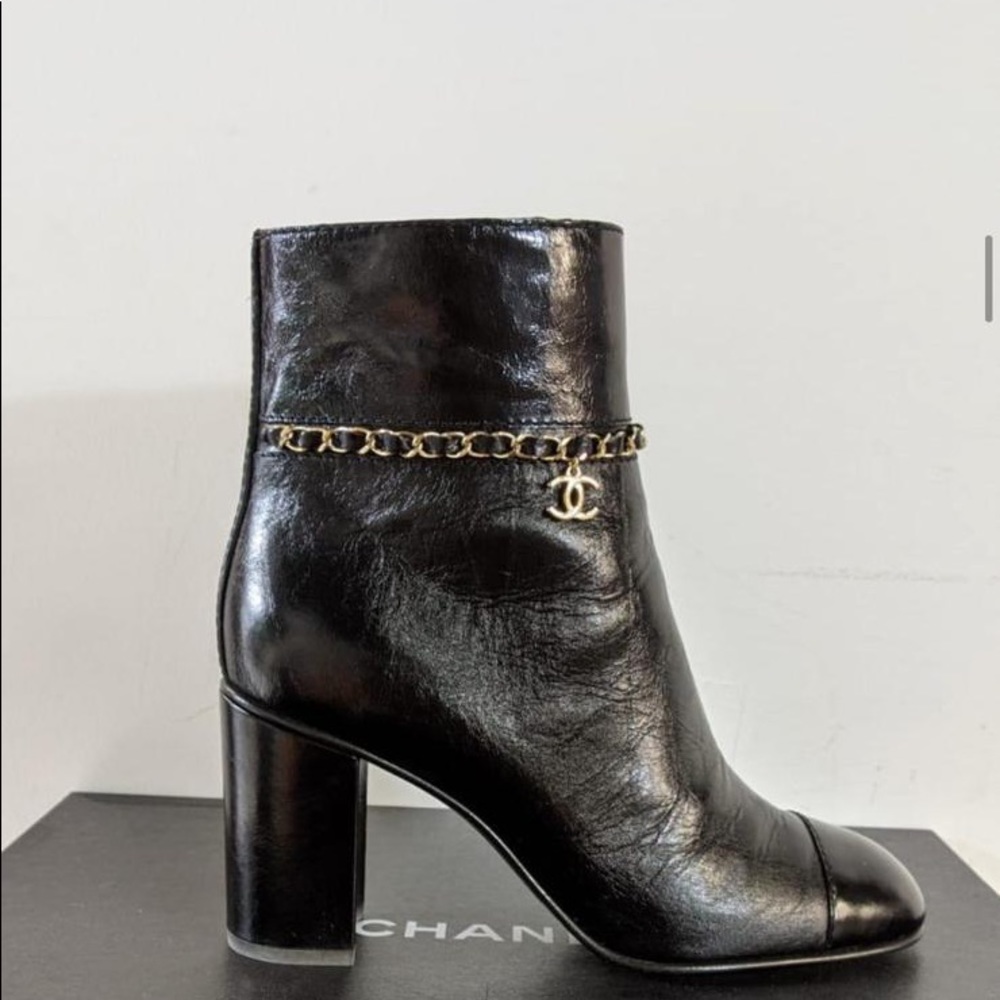 CHANEL Black Leather Ankle Boots with Gold Chain Charm
